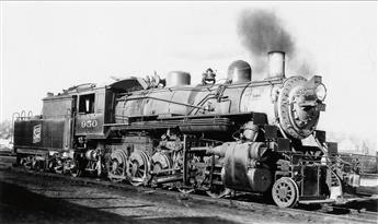 (LOCOMOTIVES) Pair of albums with more than 325 snapshots of trains from all angles and in all types of weather,